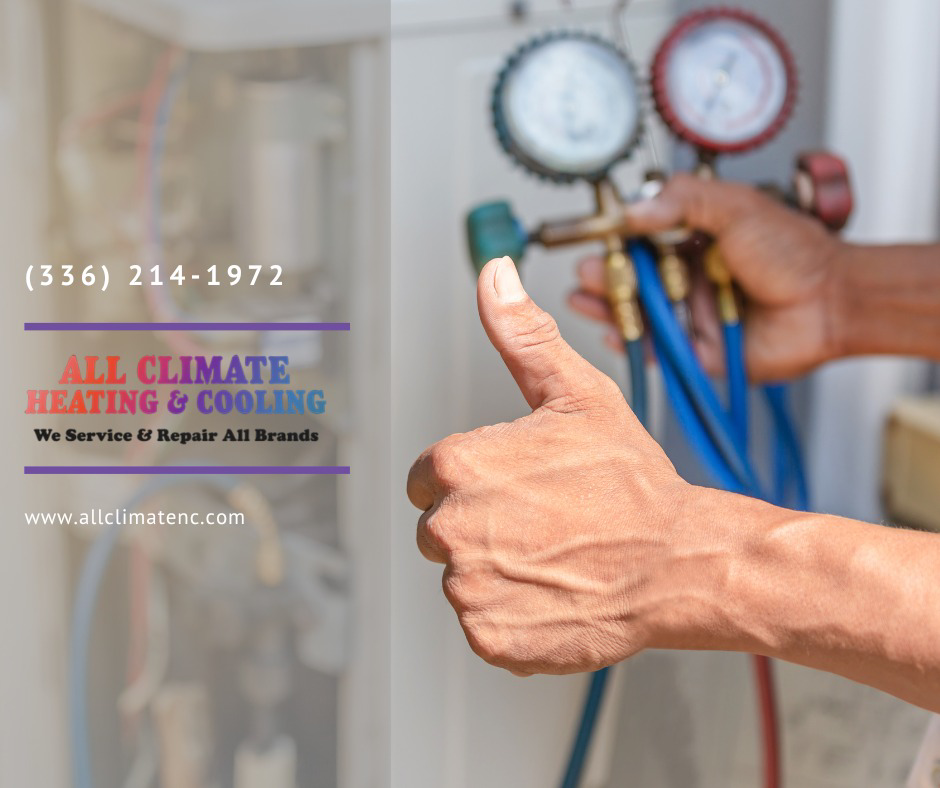A technician giving a thumbs-up after completing HVAC service with gauges at All Climate Heating & Cooling in Redmond, WA