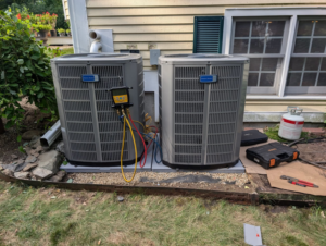 Servicing or installing two American Standard outdoor HVAC units for Frontier 44 Corp. in Melrose, MA.