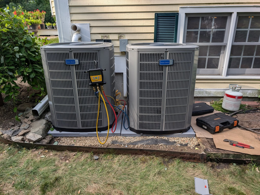 Servicing or installing two American Standard outdoor HVAC units for Frontier 44 Corp. in Melrose, MA.