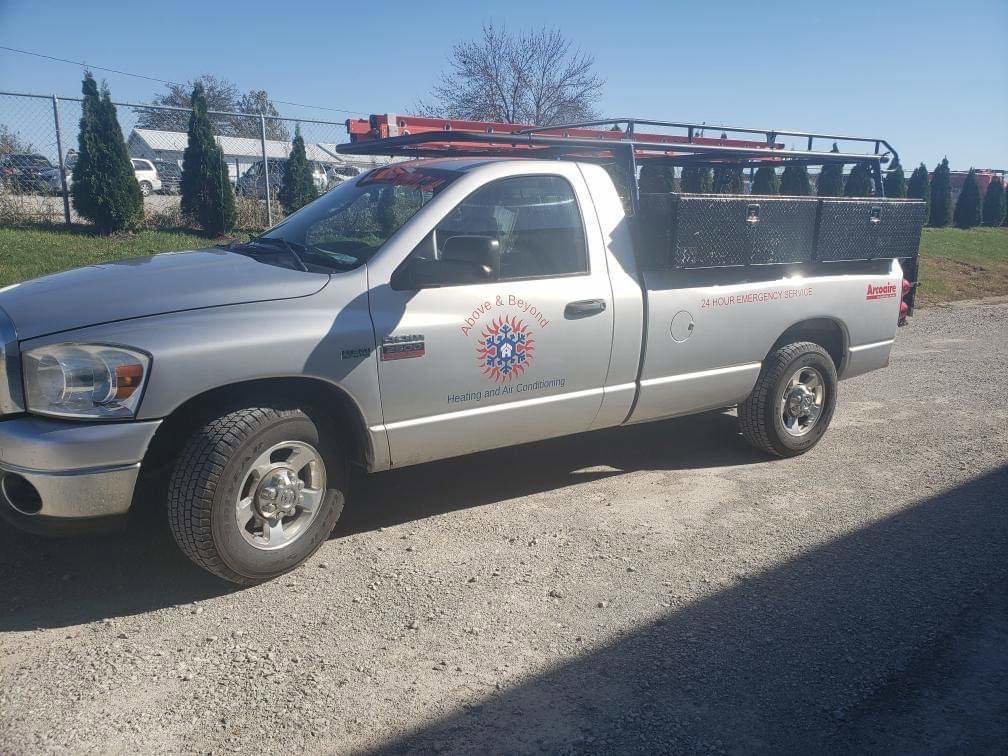 A branded service truck for Above & Beyond Heating and Air Conditioning, ready for HVAC jobs in Iowa City, IA.