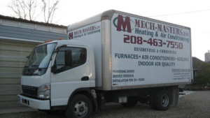A white HVAC service truck branded for Mech-Masters, Inc. in Nampa, ID, ready for residential and commercial jobs.