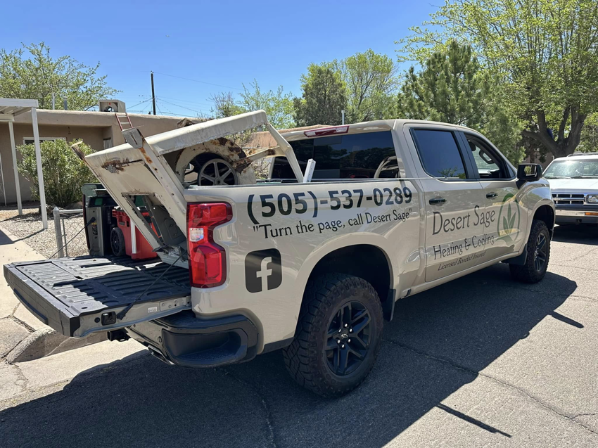 A Desert Sage Heating and Cooling service truck transporting HVAC equipment in Albuquerque, NM.