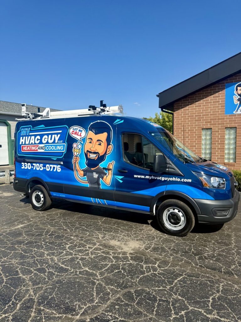 A branded My HVAC Guy service van parked outside a commercial building in North Canton, OH.