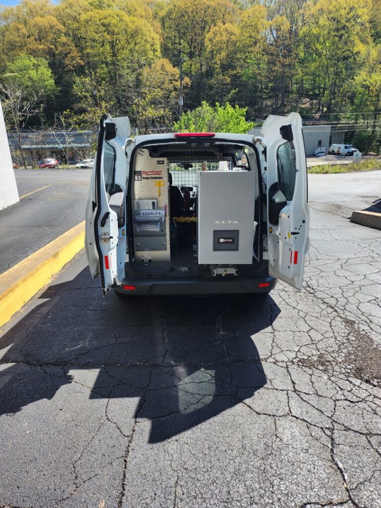 Rear view of a U.S. Boiler Company HVAC service van with open doors, showing equipment inside, for Thermoflo Equipment in Pittsburgh, PA