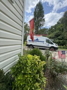 A Comfort Systems of Virginia, Inc. service van parked at a residential job site in Chesapeake, VA, ready for HVAC service.