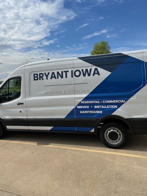 A modern branded HVAC service van for Marie Keding Bryant Iowa Heating and Cooling in Ankeny, IA.