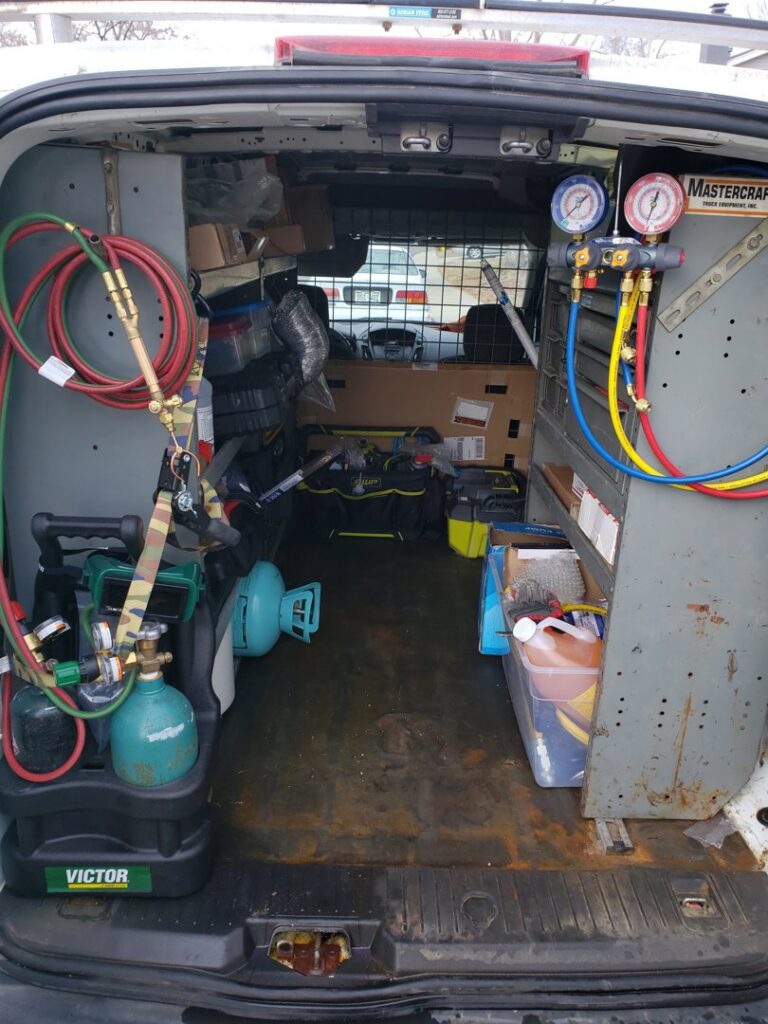An HVAC service van interior showing tools and equipment used by Thin Air Heating & Cooling Repair in Arvada, CO.
