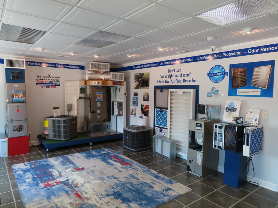 An interior showroom displaying various HVAC units and air quality products at Platinum Quality Air 500 in Hampton, VA.