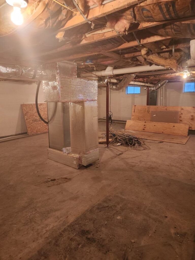 Indoor HVAC system, including furnace and ductwork, installed in a residential basement by Duct Pros in Martinsburg, WV