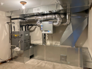 A newly installed HVAC system with furnace, extensive ductwork, and an air handler by Custom Mechanical Systems INC. in Wasilla, AK