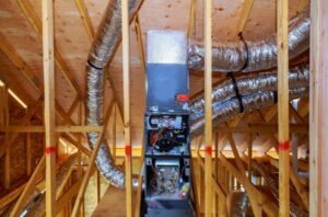 An HVAC furnace and ductwork being installed in the attic of a new construction home by Chill Out Heating and Cooling in Tulsa, OK.