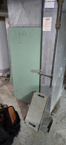 An existing HVAC system with a technician's toolbox nearby, indicating service by McBride HVAC Solutions LLC in Cincinnati, OH