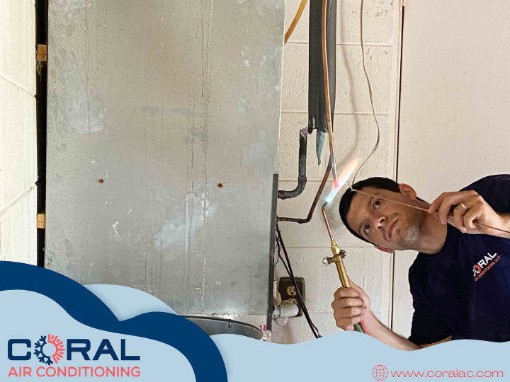 An HVAC technician from Coral Air Conditioning brazing copper refrigerant lines during an installation in Cape Coral, FL.