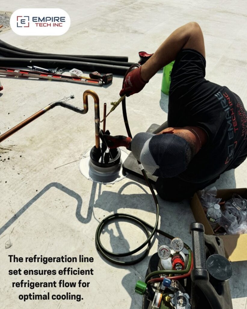 An Empire Tech, Inc. technician brazing refrigeration lines for optimal cooling on a rooftop in Schaumburg, IL.