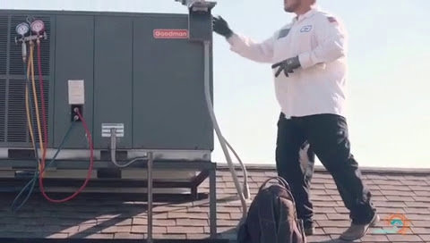 An HVAC technician checking refrigerant levels on a rooftop unit for A/C Valley, LLC in Tempe, AZ.