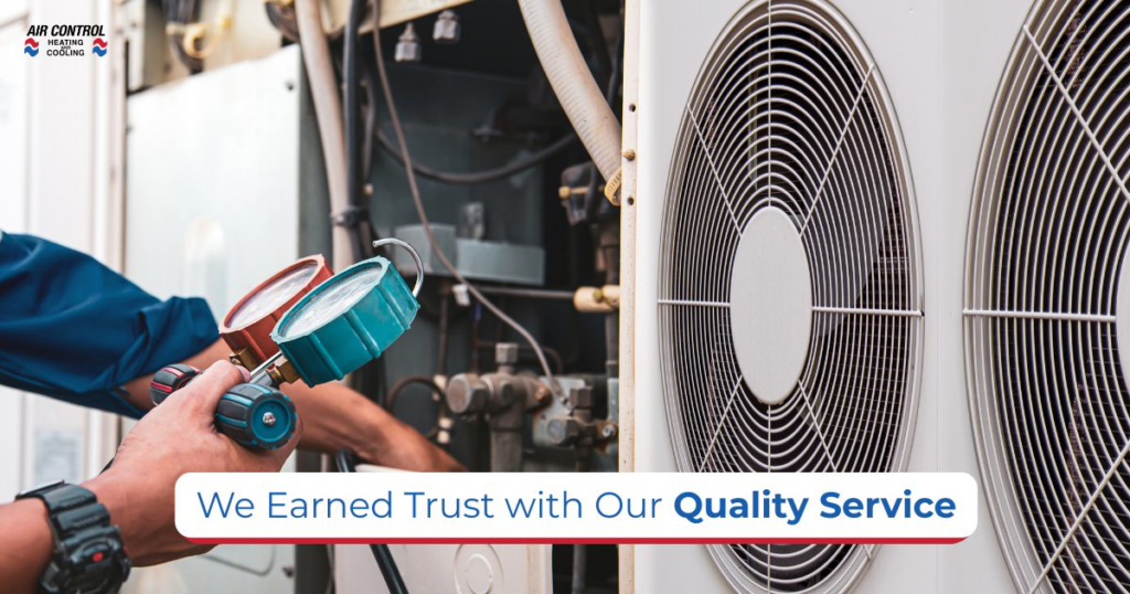 An HVAC technician checking an outdoor air conditioning unit with gauges at Air Control Heating and Cooling in Tallahassee, FL.