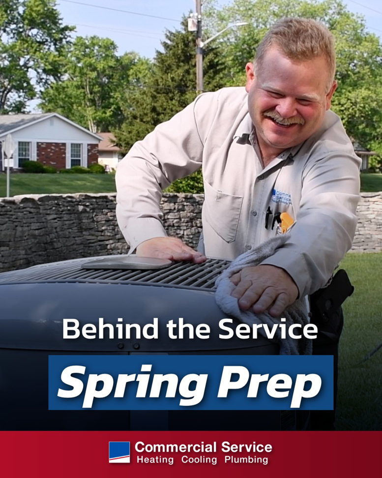 An HVAC technician cleaning an outdoor condenser unit during spring maintenance for Commercial Service in Bloomington, IN.