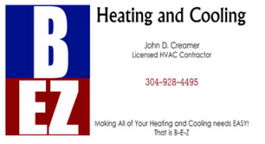 An HVAC technician from BEZ Heating and Cooling, LLC John Creamer, next to a commercial rooftop unit in Huntington, WV.