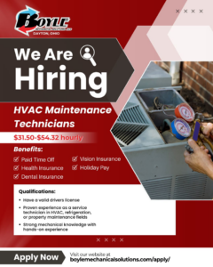 A Boyle Mechanical Solutions HVAC technician connecting pressure gauges to an outdoor unit in Dayton, OH.