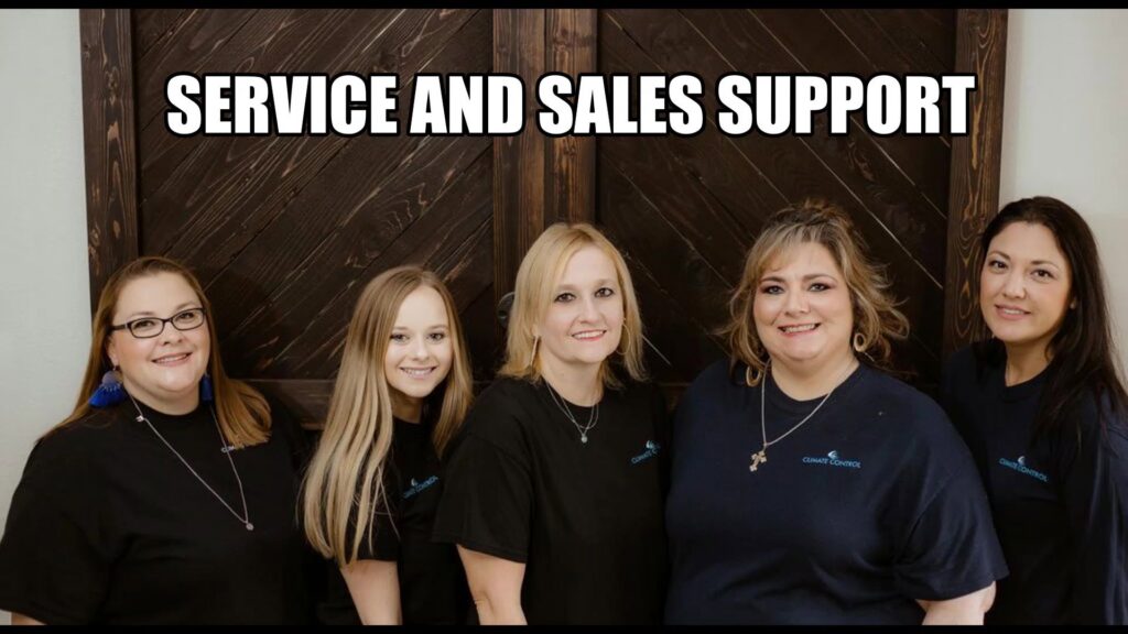An HVAC technician from Climate Control performing electrical diagnostics on an outdoor AC unit in San Antonio, TX