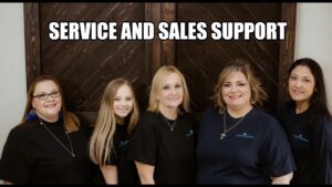 An HVAC technician from Climate Control performing electrical diagnostics on an outdoor AC unit in San Antonio, TX