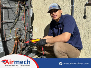 An Airmech Heating and Air Conditioning technician diagnosing an outdoor AC unit with a multimeter in Elk Grove, CA.