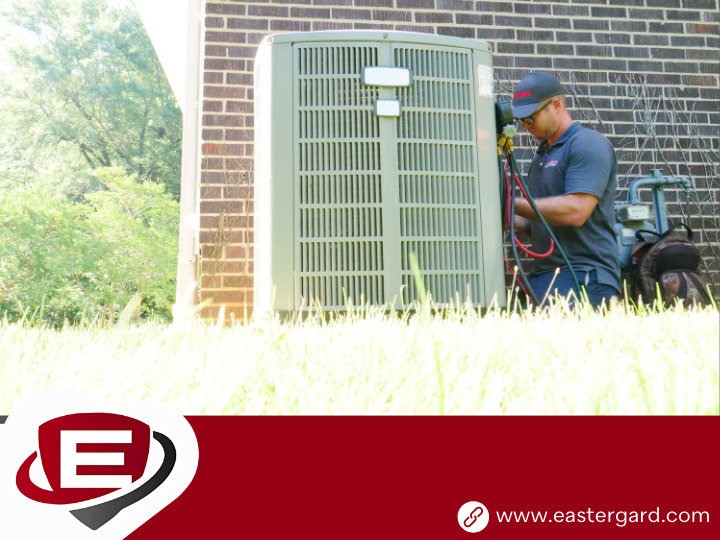 A skilled Eastergard HVAC technician inspecting an outdoor AC unit with tools in Greenville, SC.