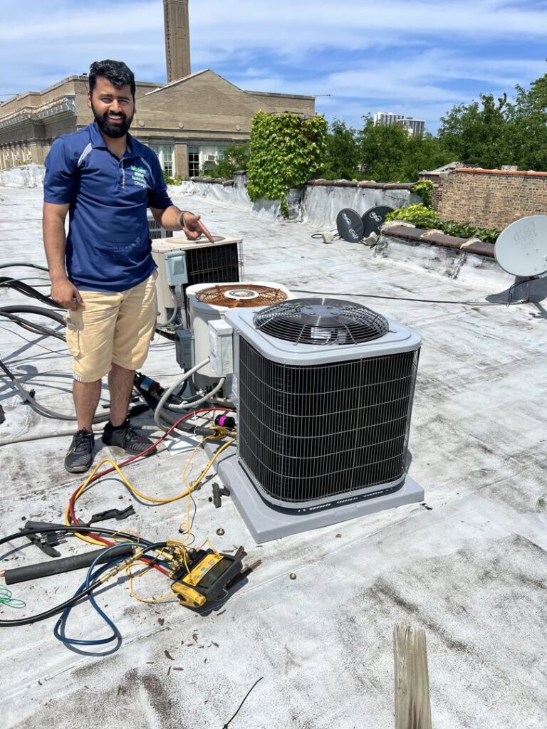 An HVAC technician inspecting multiple rooftop units with tools on a sunny day for Modern HVAC Technology in Chicago, IL.