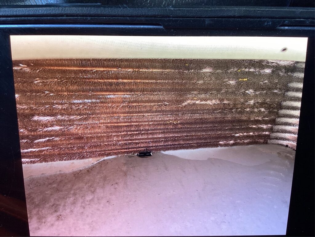 A Fluke multimeter showing a reading during an HVAC service by McCutcheon & Sons Air Conditioning and Plumbing in Tempe, AZ