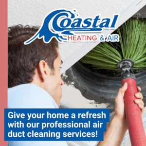 An HVAC technician performing professional air duct cleaning services for a home in Wilmington, NC, by Coastal Heating and Air.