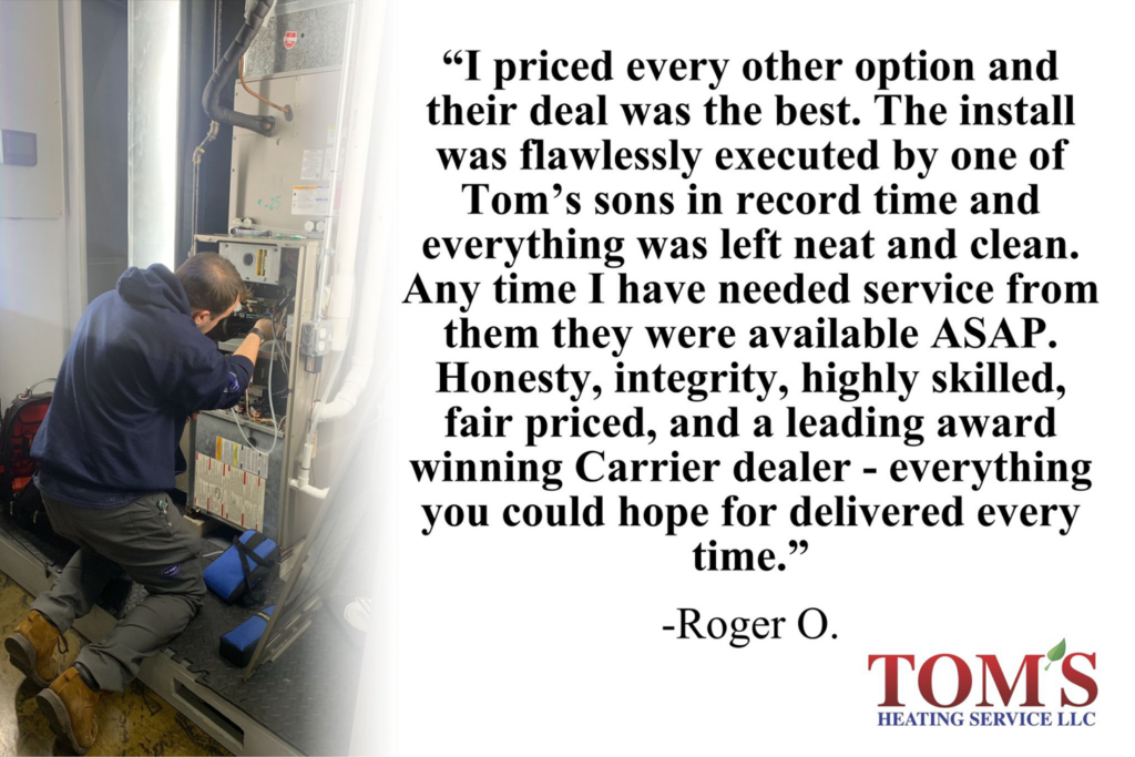 An HVAC technician repairing a furnace at a client's home for Tom's Heating Service in Waukesha, WI.