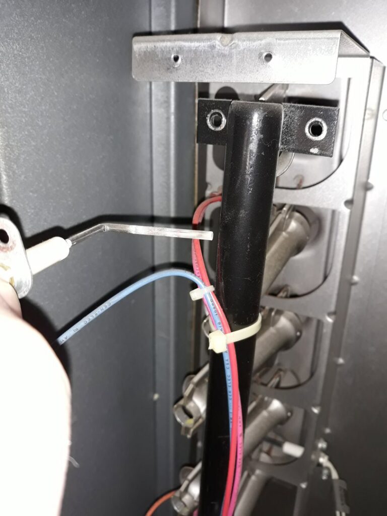 An HVAC technician from Go West A/C & Heating servicing a furnace igniter in Fort Worth, TX.