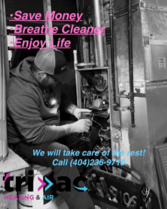 An HVAC technician performing service on an indoor furnace unit, ensuring optimal heating for customers by TRI AC in Canton, GA.