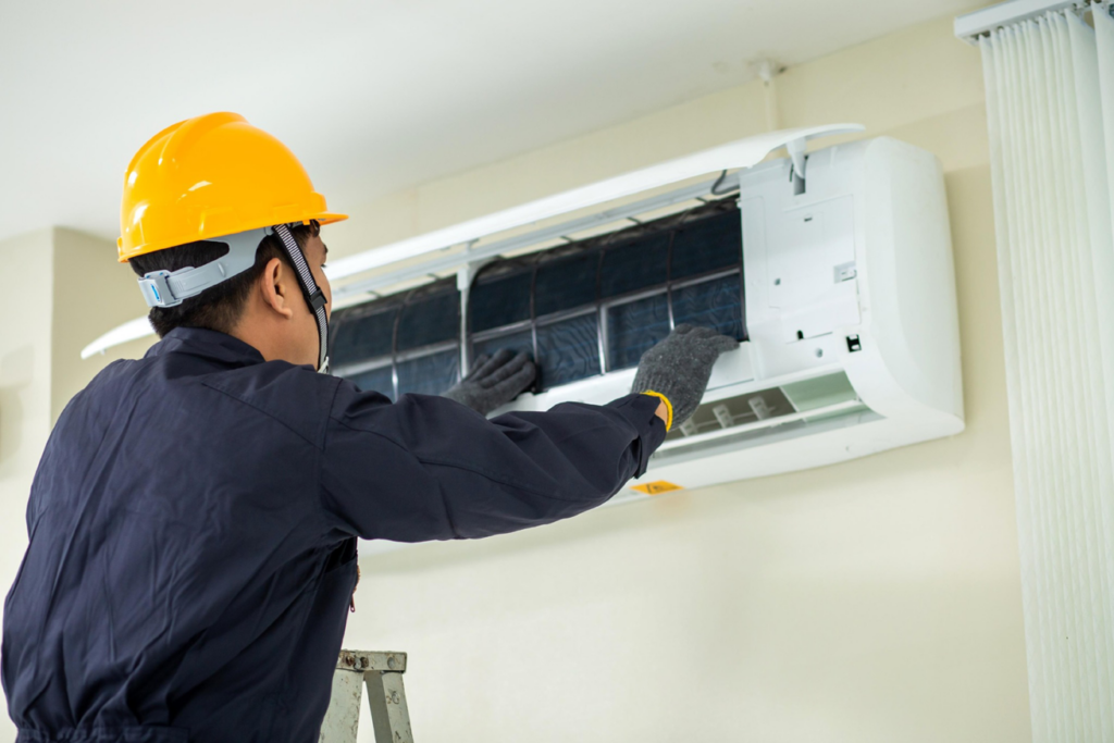 An HVAC technician servicing an indoor mini-split AC unit for Southside Energy in Chesapeake, VA.