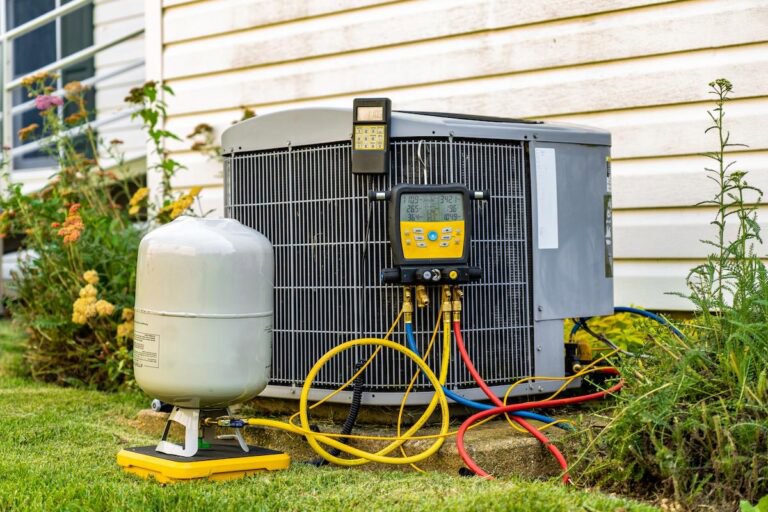 An outdoor AC unit with diagnostic tools connected, being serviced by General Air Conditioning Service Corp in Greenville, SC.