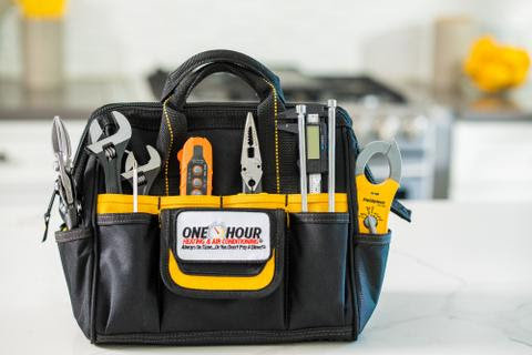 A professional HVAC technician's toolbox filled with essential tools from One Hour Heating & Air Conditioning of West Valley in Phoenix, AZ