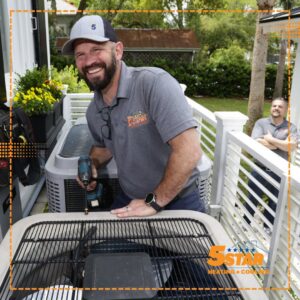 An HVAC technician performing maintenance on an outdoor air conditioning unit for 5 Star Charleston Heating and Air in Charleston, SC.