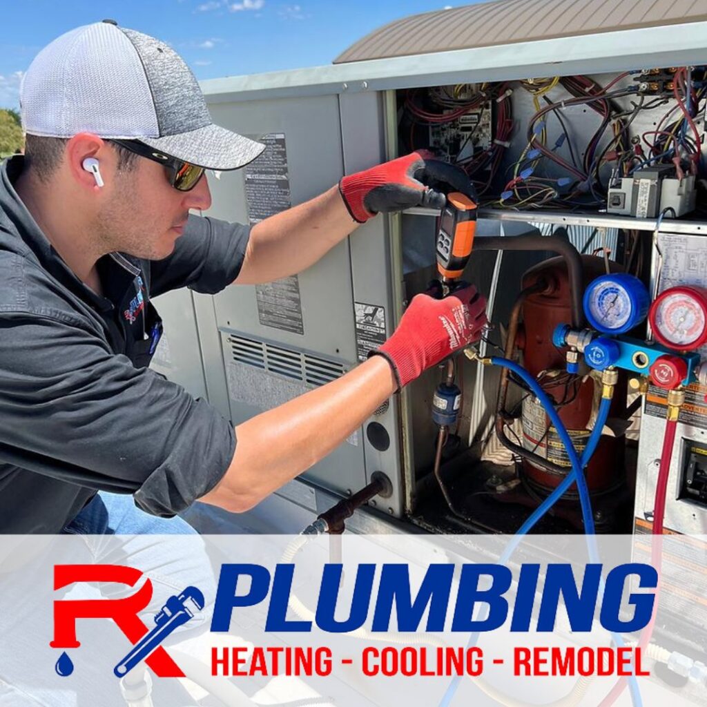 An HVAC technician from Rx Plumbing, Heating, Cooling & Remodel working on an outdoor air conditioning unit in Los Ranchos de Albuquerque, NM.