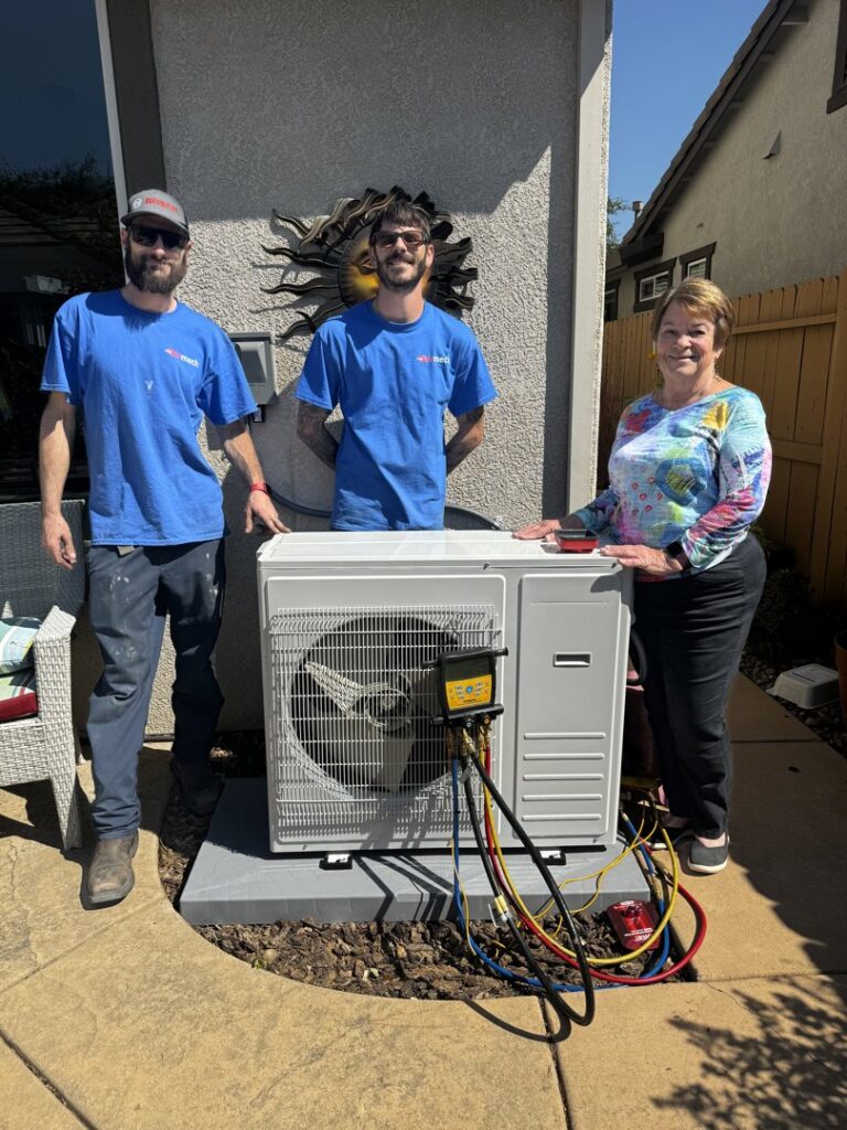 Airmech Heating and Air Conditioning technicians with a happy customer after a new mini-split installation in Elk Grove, CA.