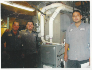 HVAC technicians from KCA Companies, Inc. installing a new furnace and ductwork in Denver, CO