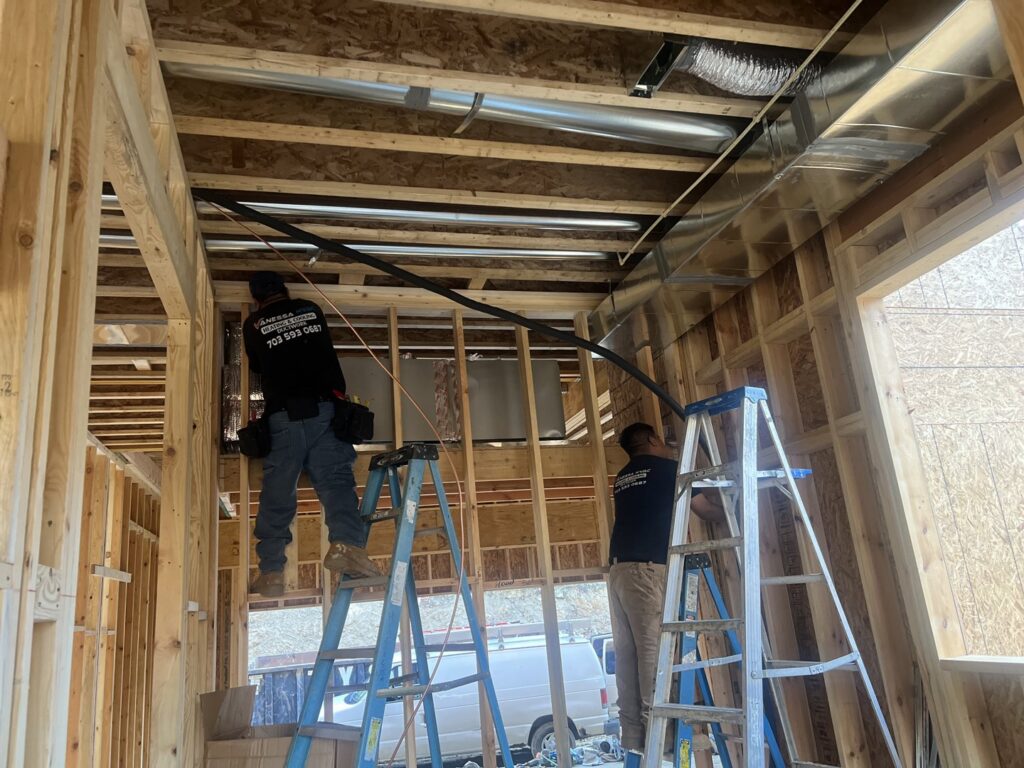 Vanessa Service HVAC technicians installing ductwork in a new construction home in Falls Church, VA.
