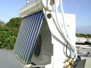 Two HVAC technicians installing a new outdoor AC unit for ChillTek AC Repair Glendale in Glendale, AZ.