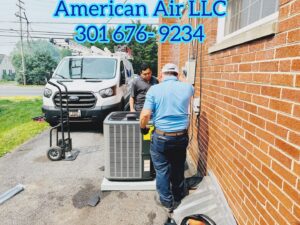 Two HVAC technicians from American Air LLC installing an outdoor AC unit at a residential property in Moncks Corner, SC