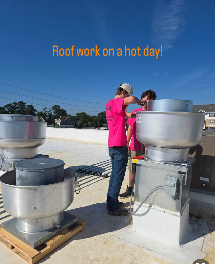 HVAC technicians installing commercial rooftop ventilation units for Pepeta Service Inc. in Clayton, DE