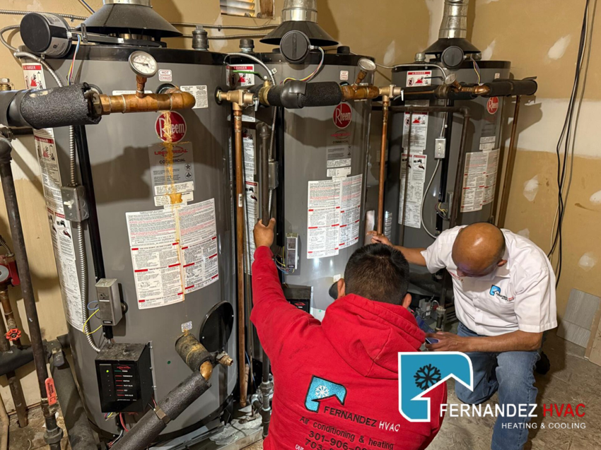 HVAC technicians from Fernandez HVAC installing multiple water heaters in Alexandria, VA.