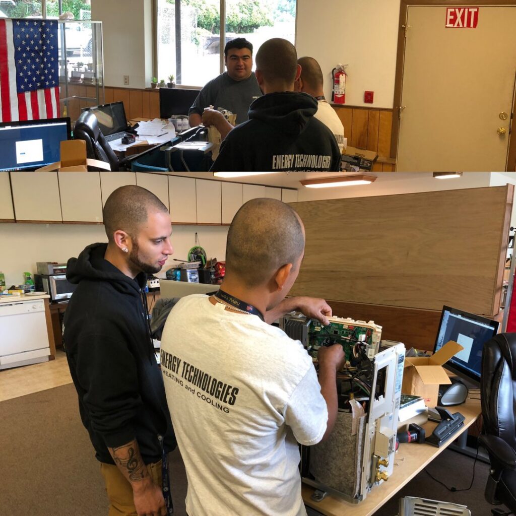HVAC technicians from Energy Technologies repairing an indoor mini-split unit in Seattle, WA.