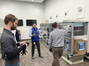 HVAC technicians training on large air handling units at Buckley Associates, Inc. in Hanover, MA