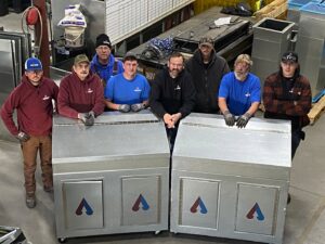 HVAC technicians with custom metal equipment at Advanced Comfort Solutions, Inc. in Cheyenne, WY.