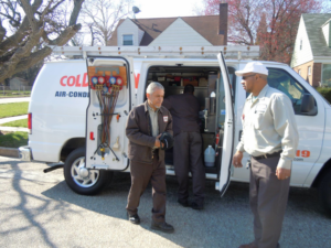 HVAC technicians with tools and equipment from Coldspring Co Inc. preparing for a job in Baltimore, MD