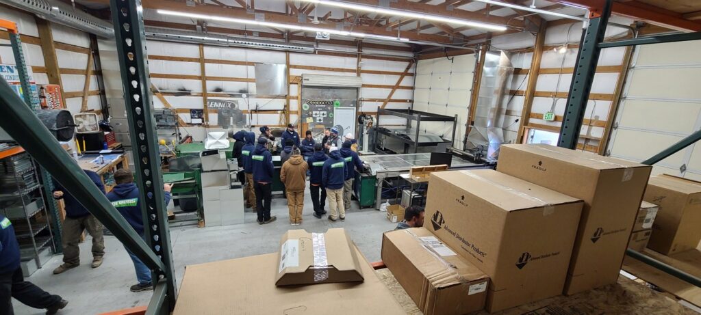 HVAC technicians from Greens Heating & Air Conditioning working on various tasks in their workshop, Douglasville, GA.